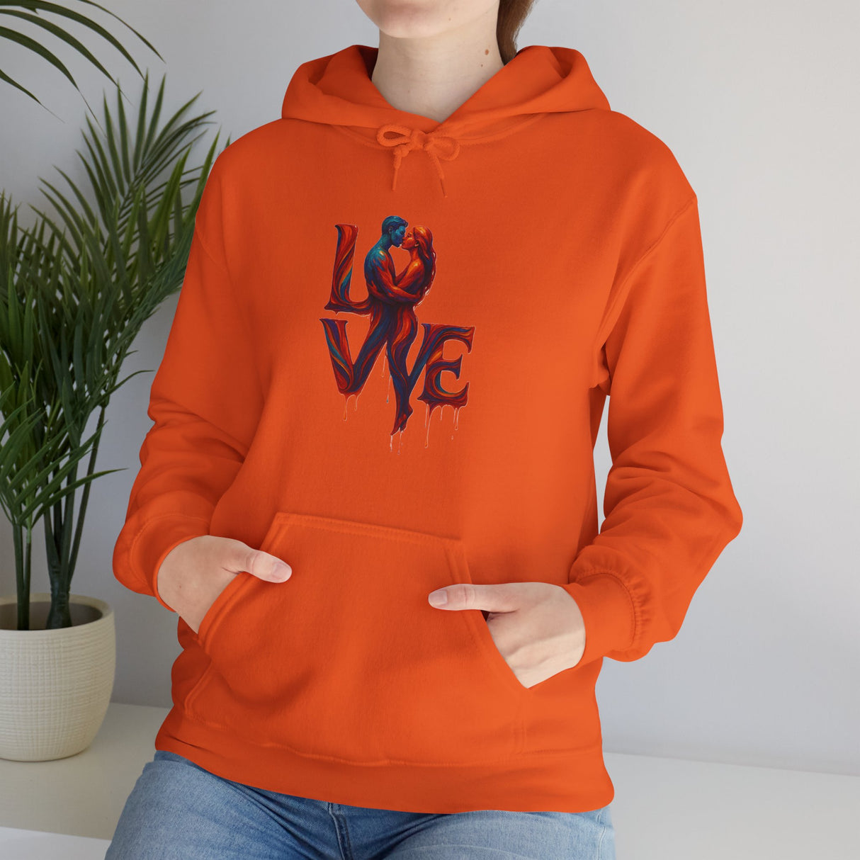 Couple in matching Love Kiss Hoodies, representing love and togetherness.