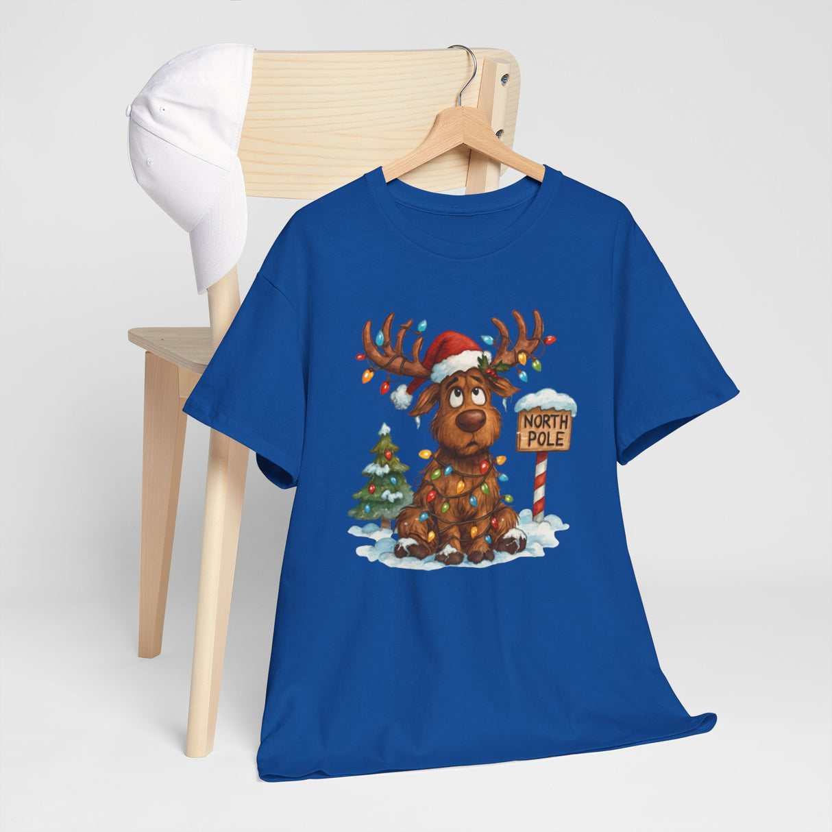 Christmas Reindeer Tee in a playful setting, celebrating the holiday season with style.
