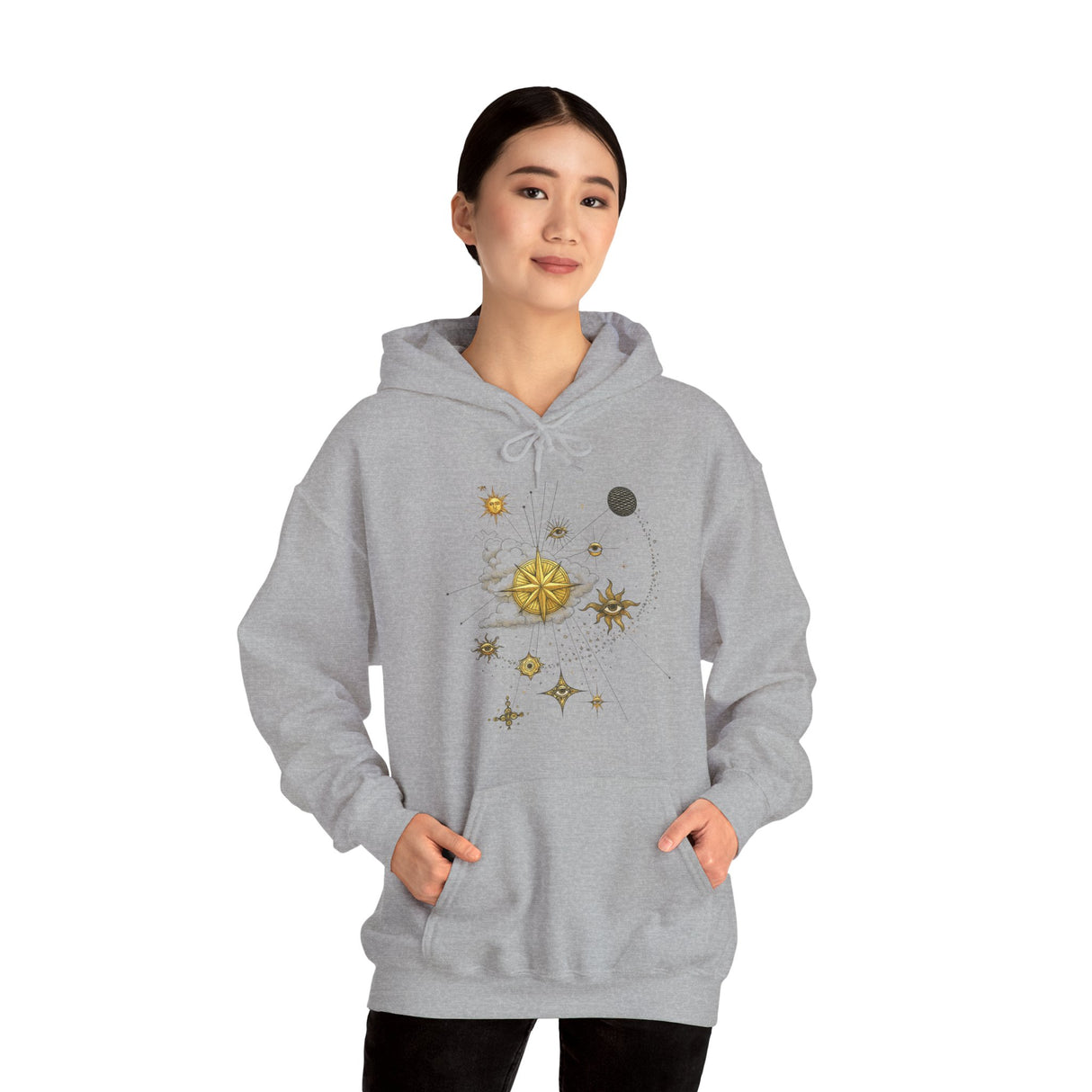 Model wearing the Celestial Compass Hoodie with gold star and sun astronomy graphic, styled with casual jeans.