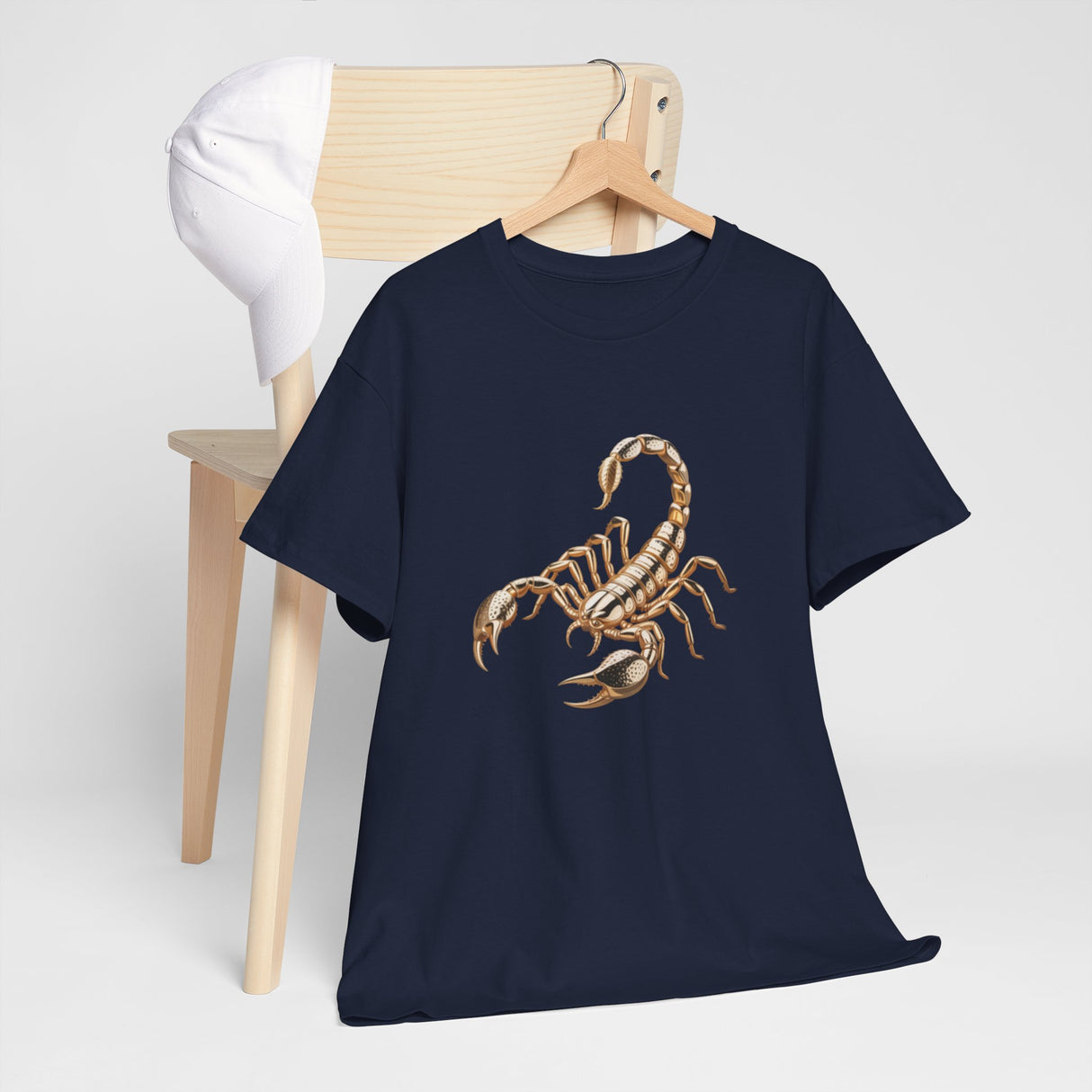 Front view of the Scorpion Graphic Tee — Desert Scorpion Illustration T-Shirt laid flat on a wooden surface.