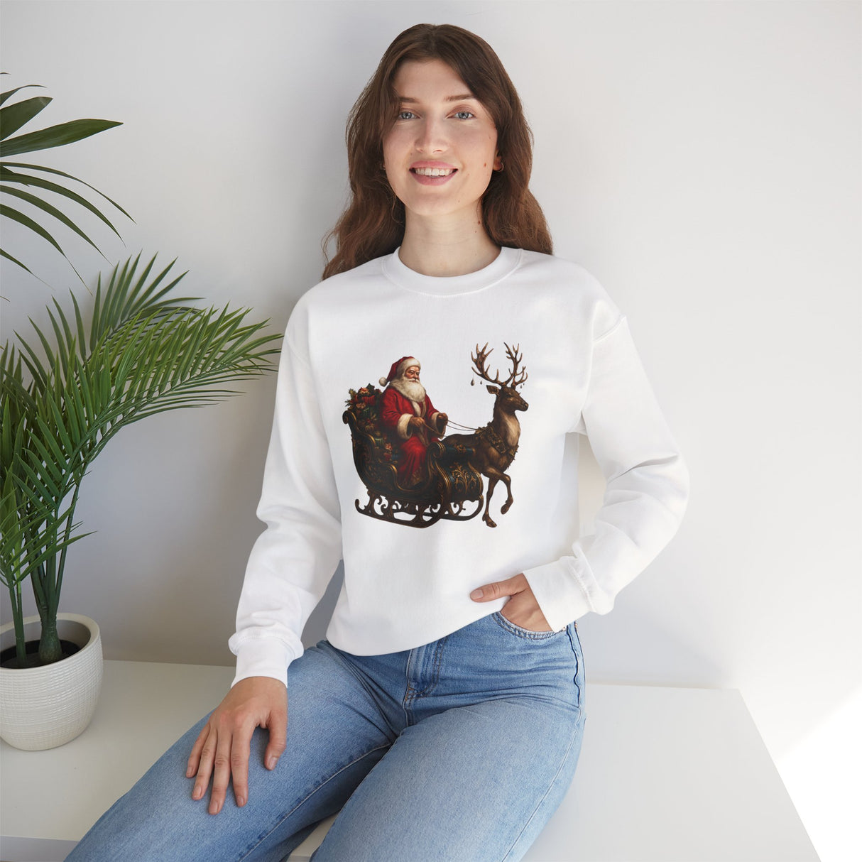 The Winter Art Vintage Santa Sleigh Crewneck Sweatshirt shown in a festive outdoor setting, perfect for winter celebrations.