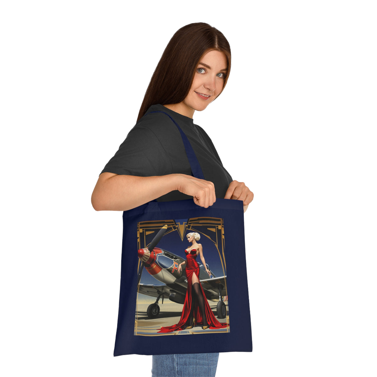 A person posing with the Vintage Pin-Up Plane Tote — Red Dress Aviation Cotton Tote Bag at a gallery event, embodying old-Hollywood charm.