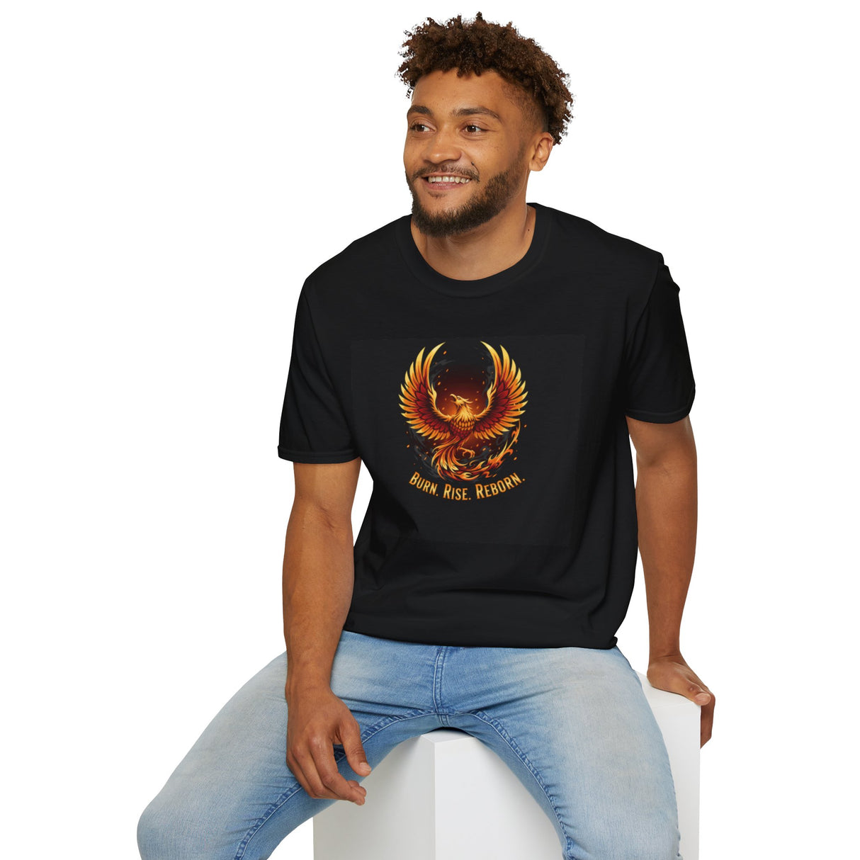 Man wearing Phoenix Graphic T-Shirt Burn Rise Reborn Flame Design in urban setting, featuring a vibrant phoenix design. on a vibrant black background.