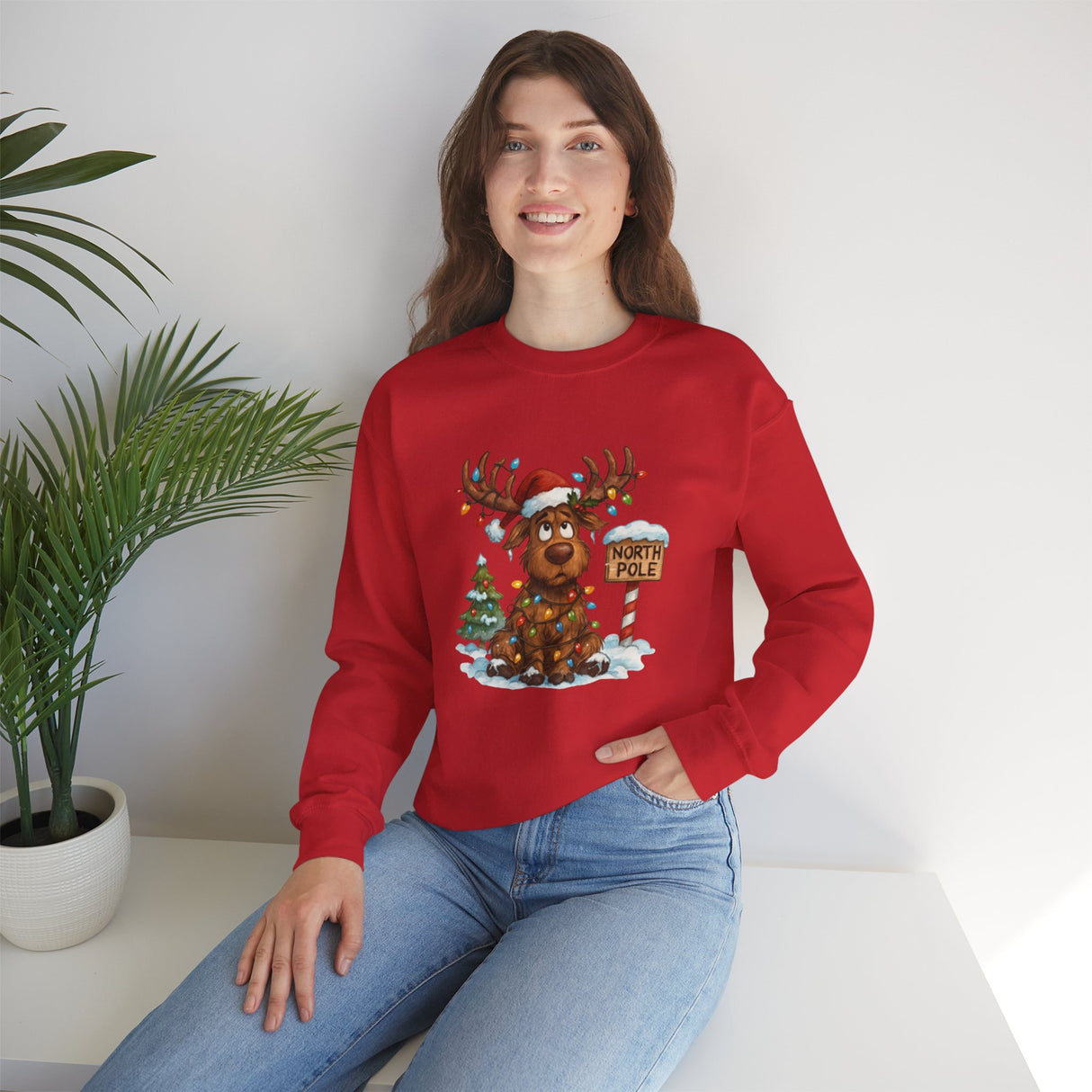 Christmas Moose Crewneck Sweatshirt with a relaxed fit featuring festive reindeer and holiday vibes.