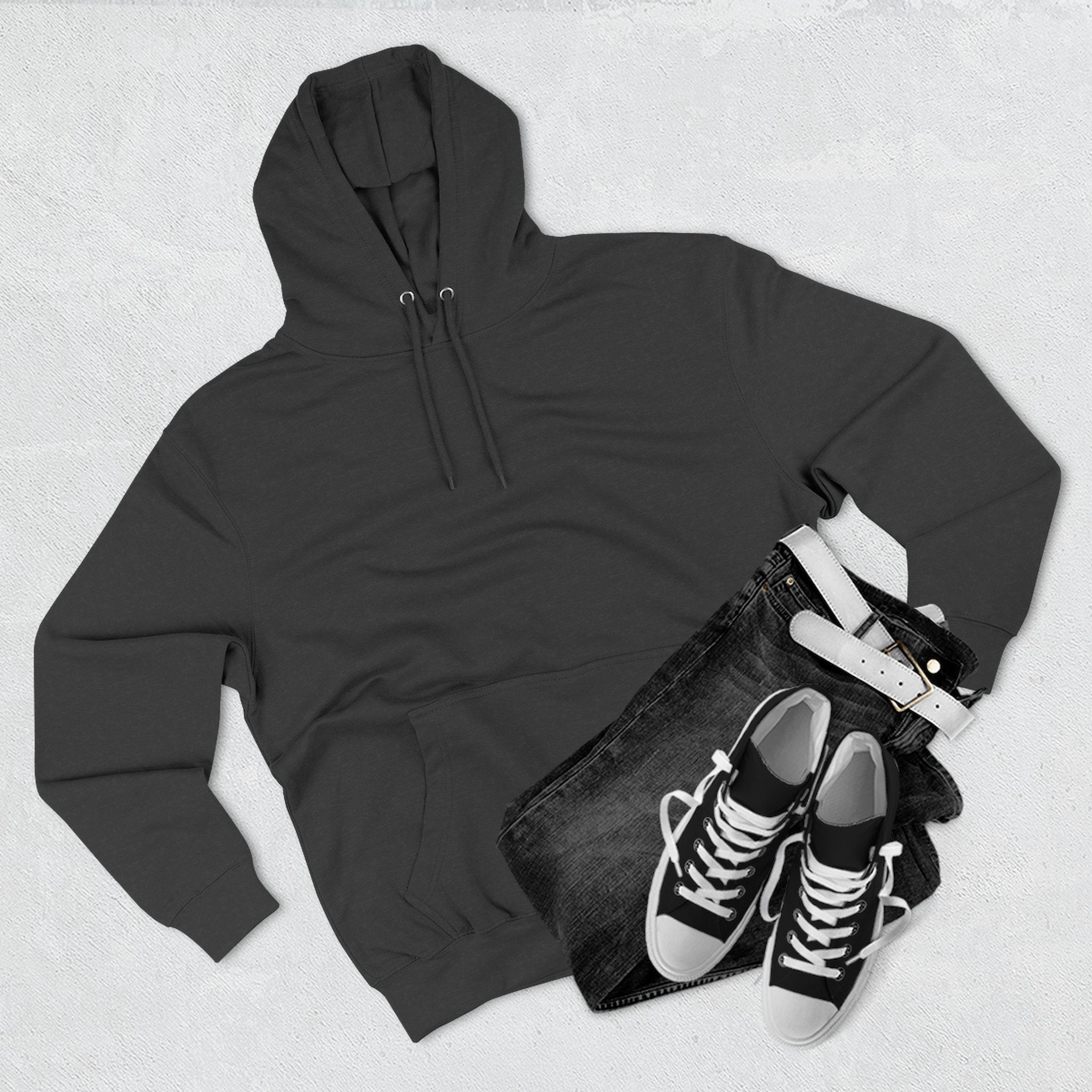 Aviator Three-Panel Hoodie laying flat, highlighting its soft fleece interior and color.