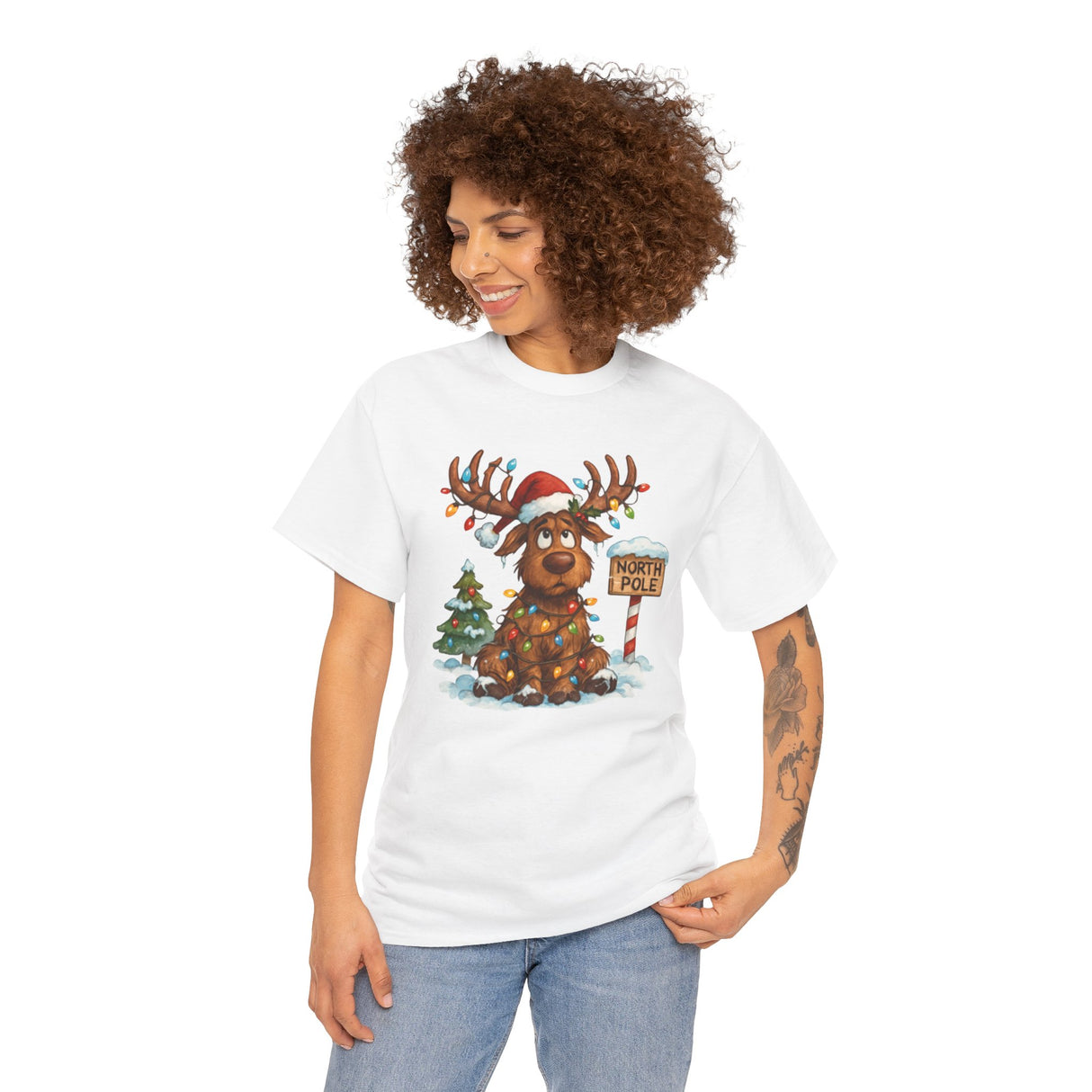 Christmas Reindeer Tee displayed on a hanger, emphasizing its cozy cotton material.