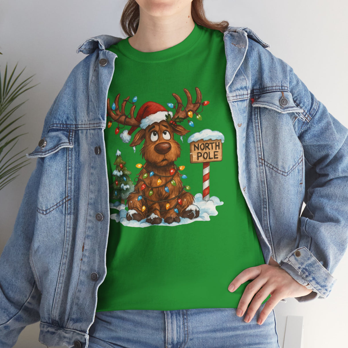 Christmas Reindeer Tee featuring a whimsical reindeer and colorful Christmas lights, perfect for holiday wear.