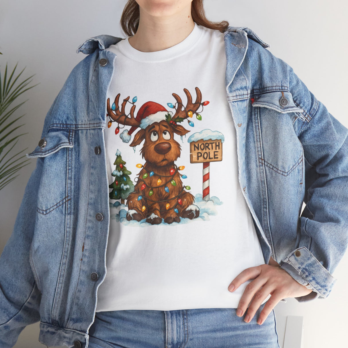 Festive scene featuring the Christmas Reindeer Tee being worn at a holiday party.