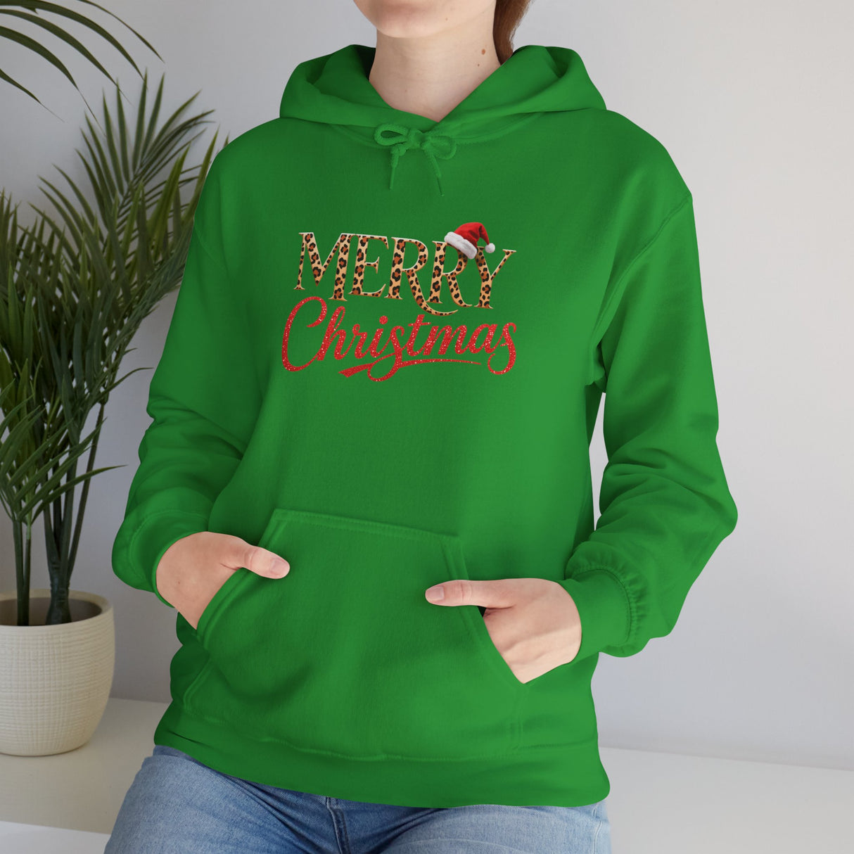Merry Christmas Hoodie laid flat to feature its soft fabric and design details.