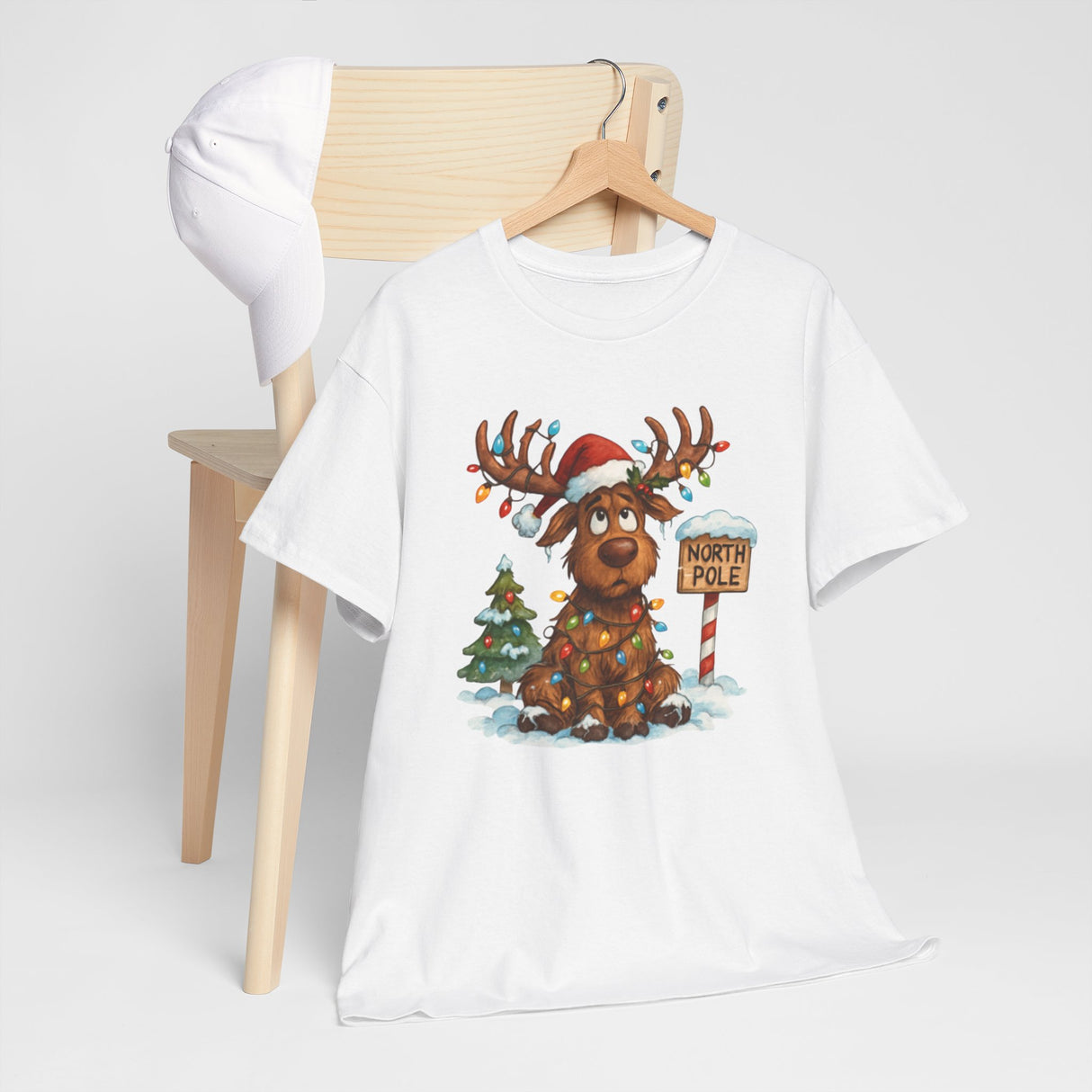 Playful design elements on the Christmas Reindeer Tee, including a tree and lights.