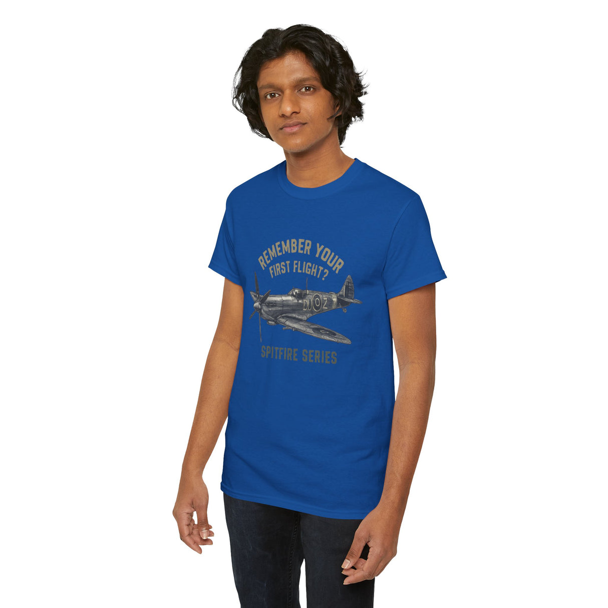 The Spitfire Series 'Remember Your First Flight' Tee on a model against an airport backdrop, showcasing aviation style.
