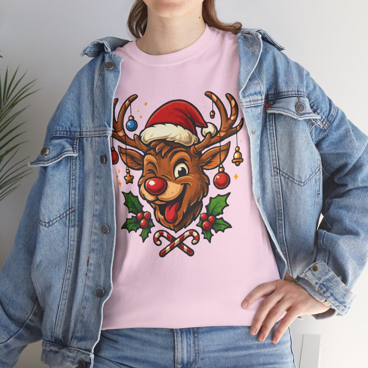 Christmas Reindeer Tee paired with festive decorations, perfect for family holiday celebrations.