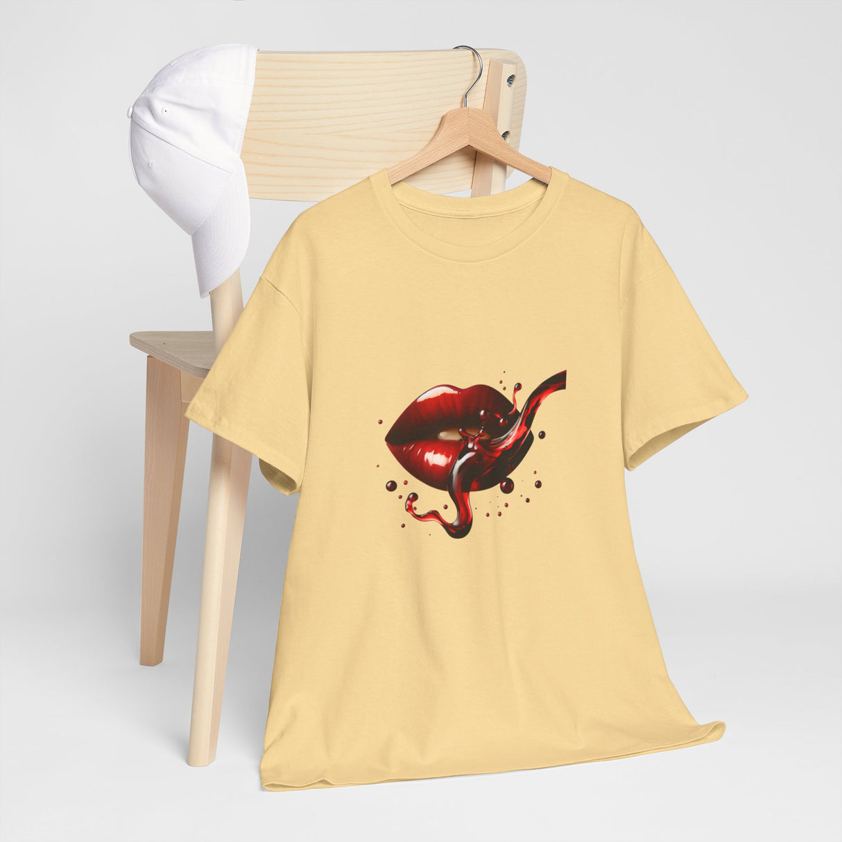 Model posing confidently in the Lip Bite Graphic Tee under city lights.