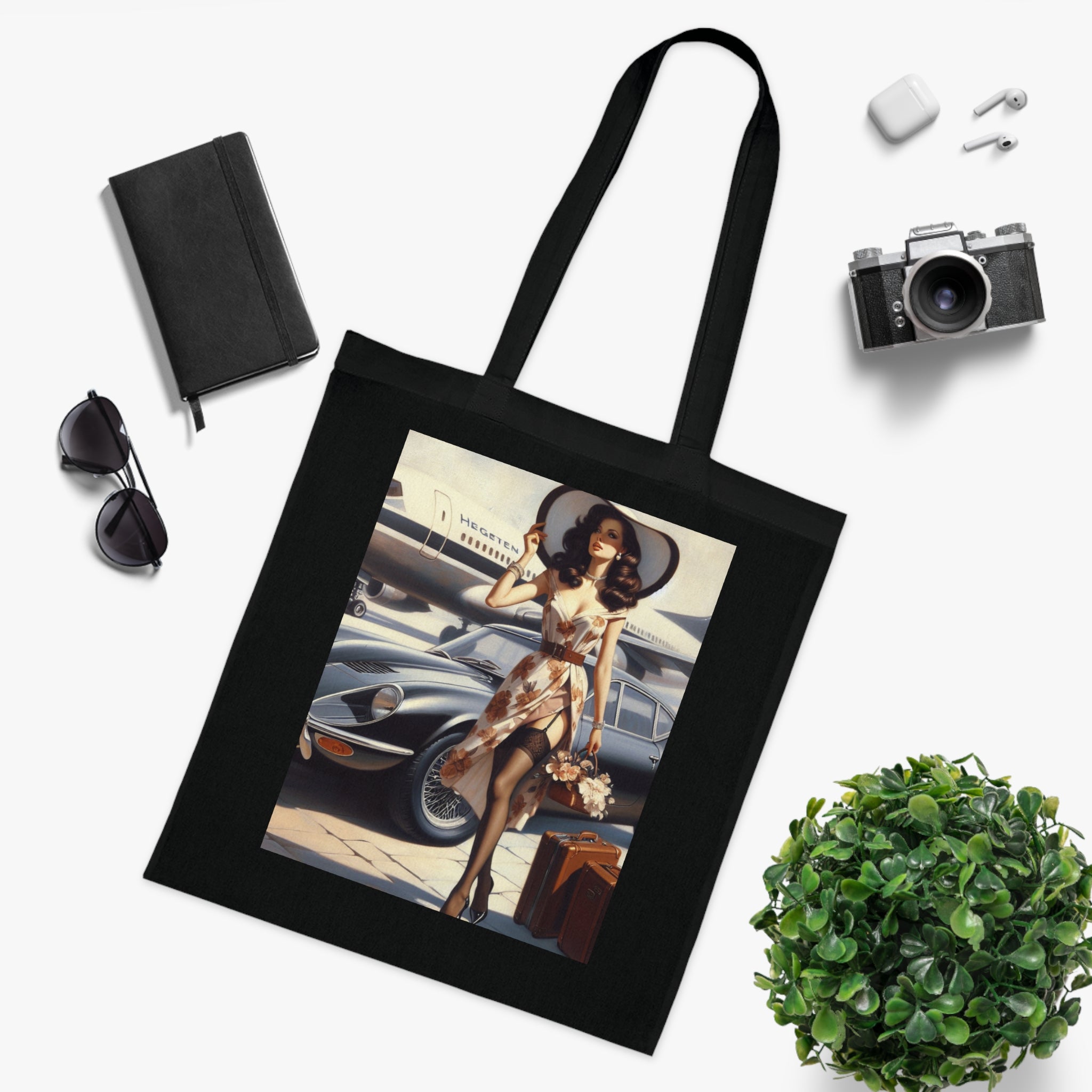 The Vintage Jetsetter Cotton Tote Bag hanging by a door, showing off its unique travel illustration and practical use.