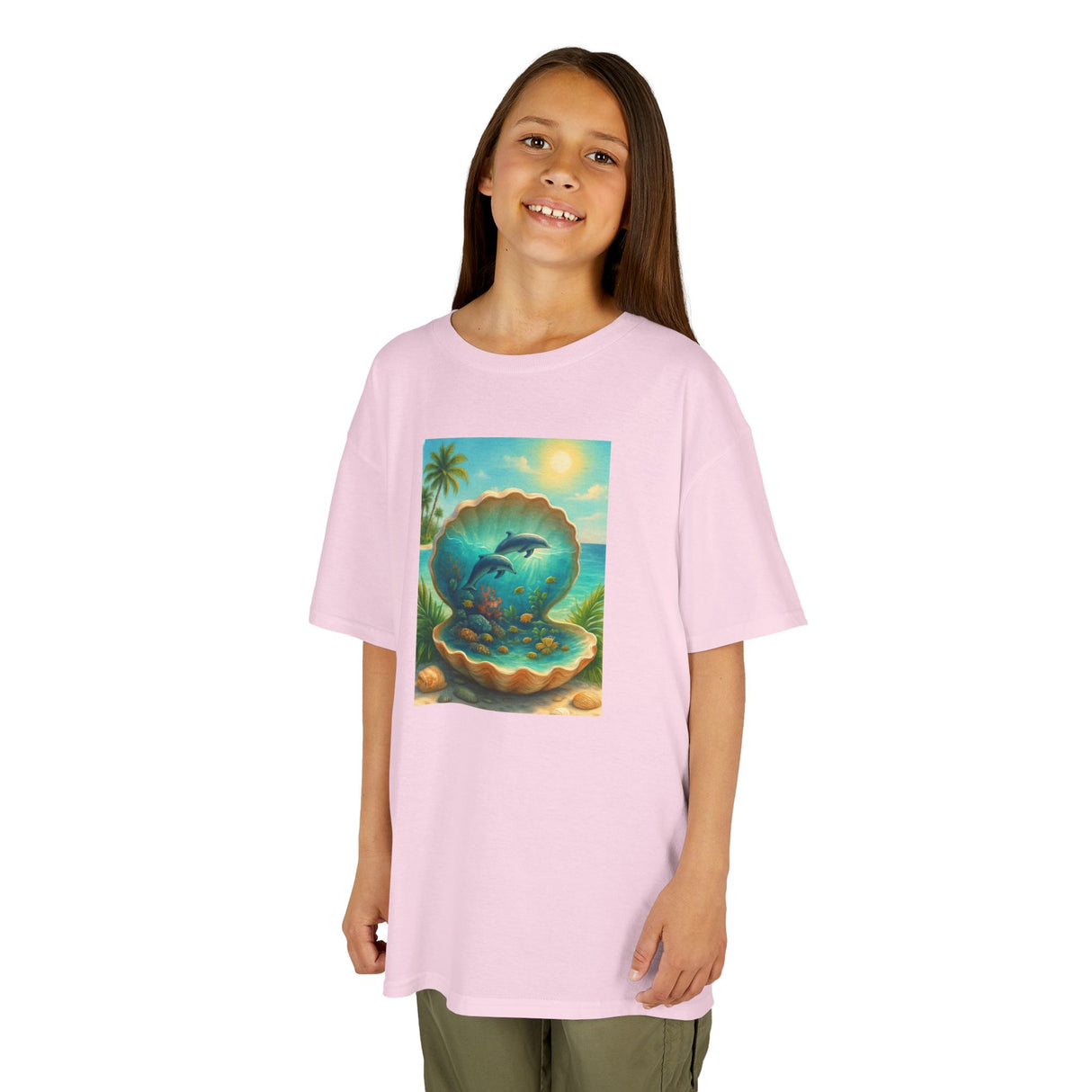 Kids Tee — Ocean Pearl Dolphin Shell Beach Graphic displayed in a sunny outdoor setting to emphasize its playful nature.