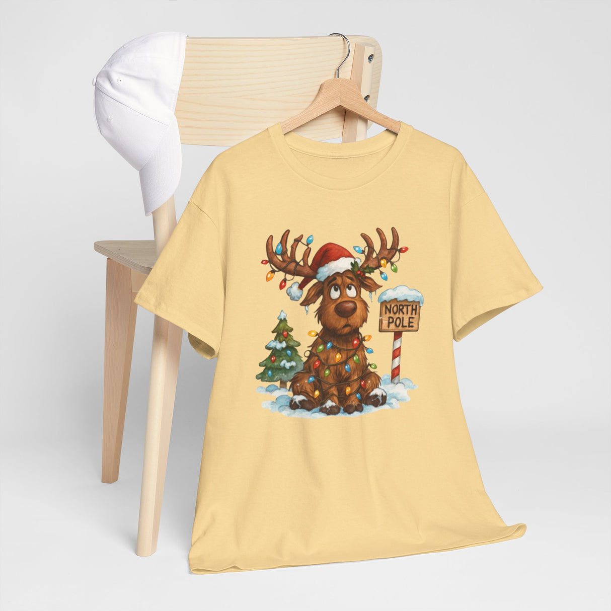 Casual wear featuring the Christmas Reindeer Tee, perfect for relaxed nights by the fire.