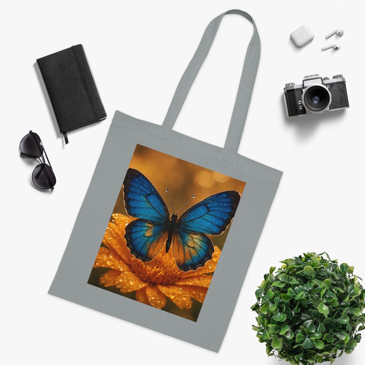 Blue Butterfly Cotton Tote — Nature Floral Reusable Shopper Bag placed on a wooden table, reminding of sustainable fashion.