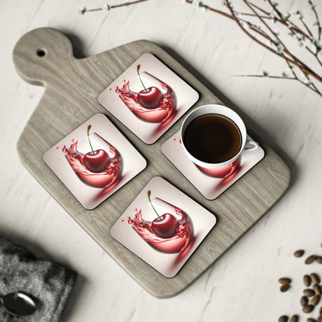 Vibrant Drink Coasters featuring a stunning cherry splash design, displayed alongside a coffee mug on a wooden surface, perfect for adding color to your home decor.