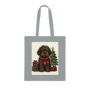 Lightweight cotton Christmas Dog Tote Bag displaying a festive fluffy dog by a decorated tree.