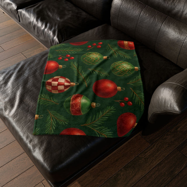 Cozy green and red Christmas ornament holiday blanket draped over a cozy couch, enhancing the festive atmosphere.