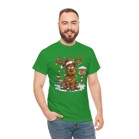 Christmas Reindeer Tee featuring a cute Santa Hat Moose wrapped in colorful Christmas lights and standing by a North Pole sign.