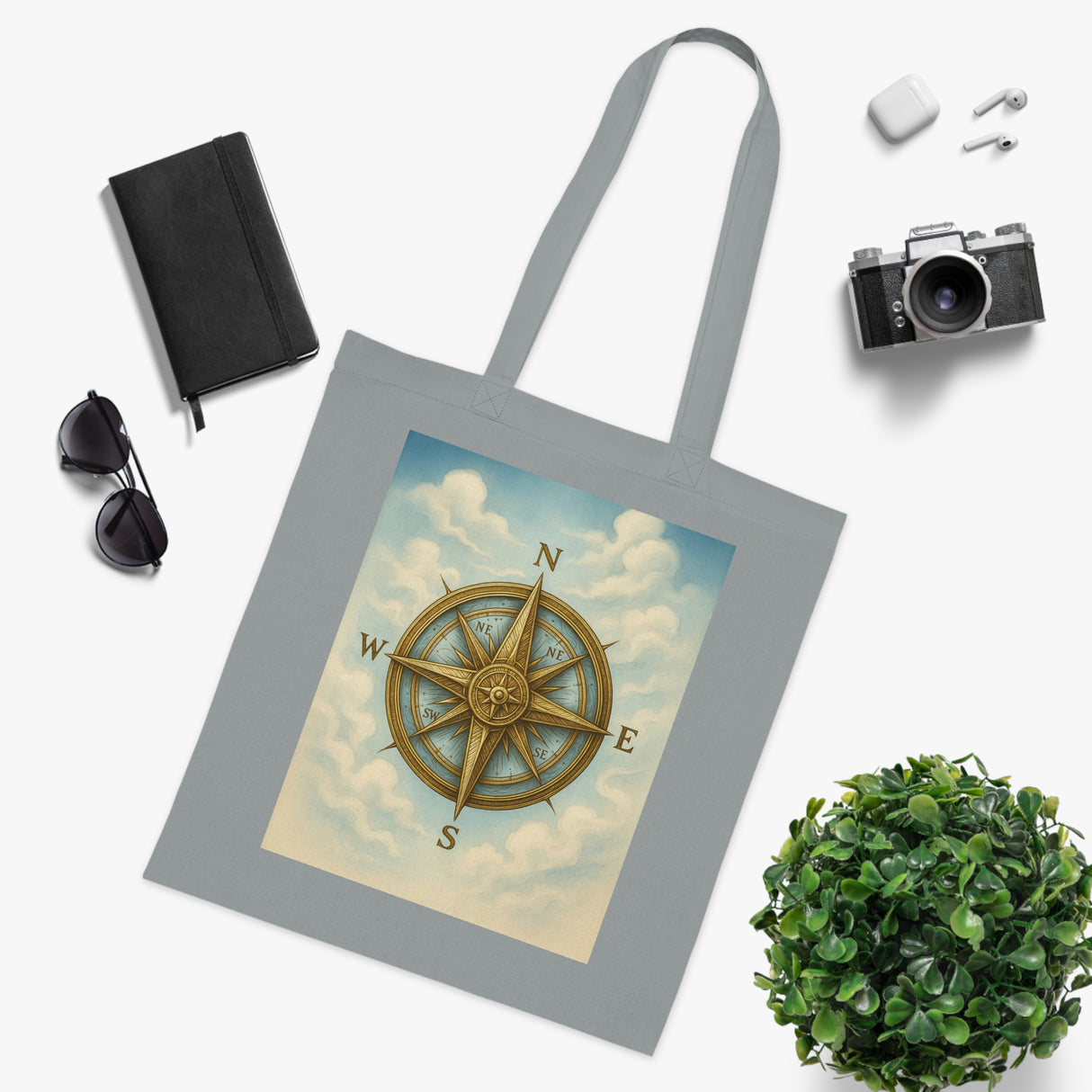 Vintage Compass Cotton Tote Bag on display in a retail store showcasing its design.
