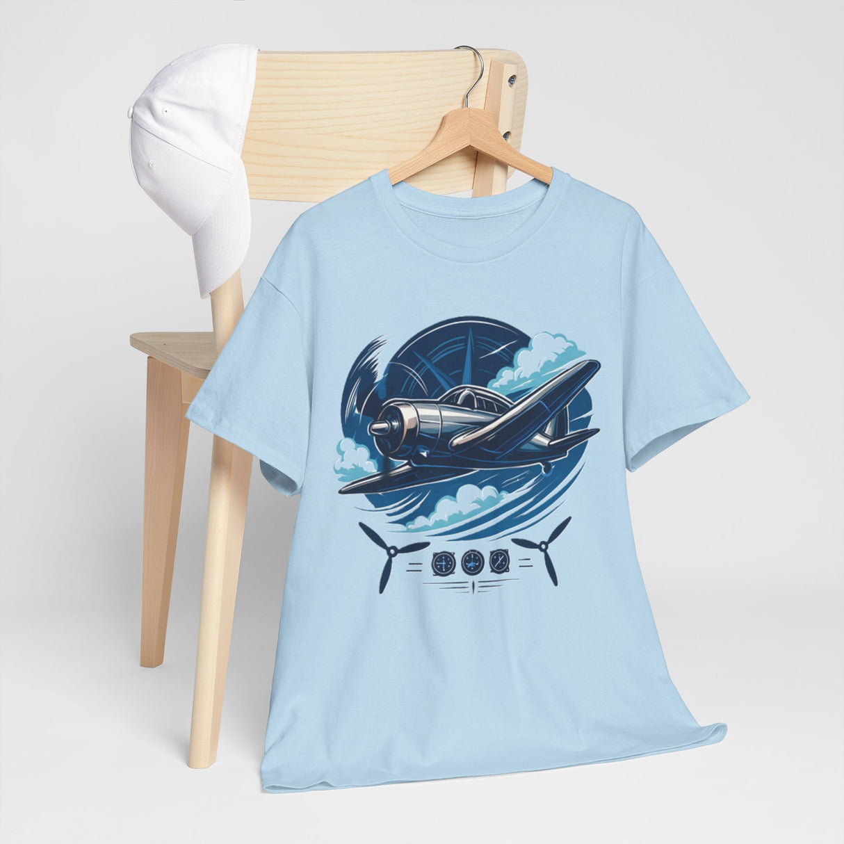 Flat lay of Vintage Propeller Plane T-Shirt alongside aviation-themed accessories like a compass and goggles.