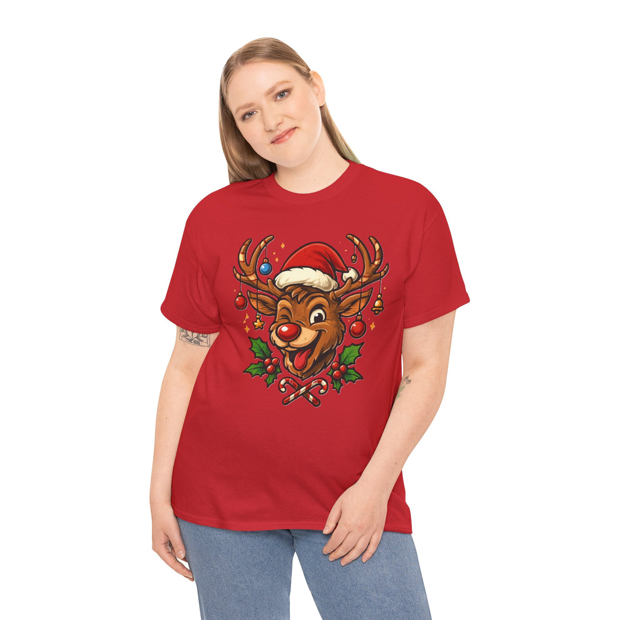The Christmas Reindeer Tee laid out on a festive blanket, surrounded by holiday-themed props.