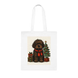 Cute fluffy dog wearing a red scarf surrounded by holiday gifts on a Christmas Tote.