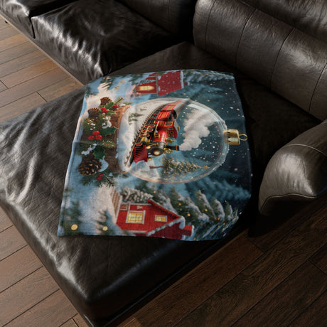 Close-up view of the Christmas Train Snow Globe Blanket's soft plush texture, ideal for holiday gatherings.