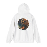 Casual display of the Yin Yang Moon & Sun Hoodie on a table with other fashion items.