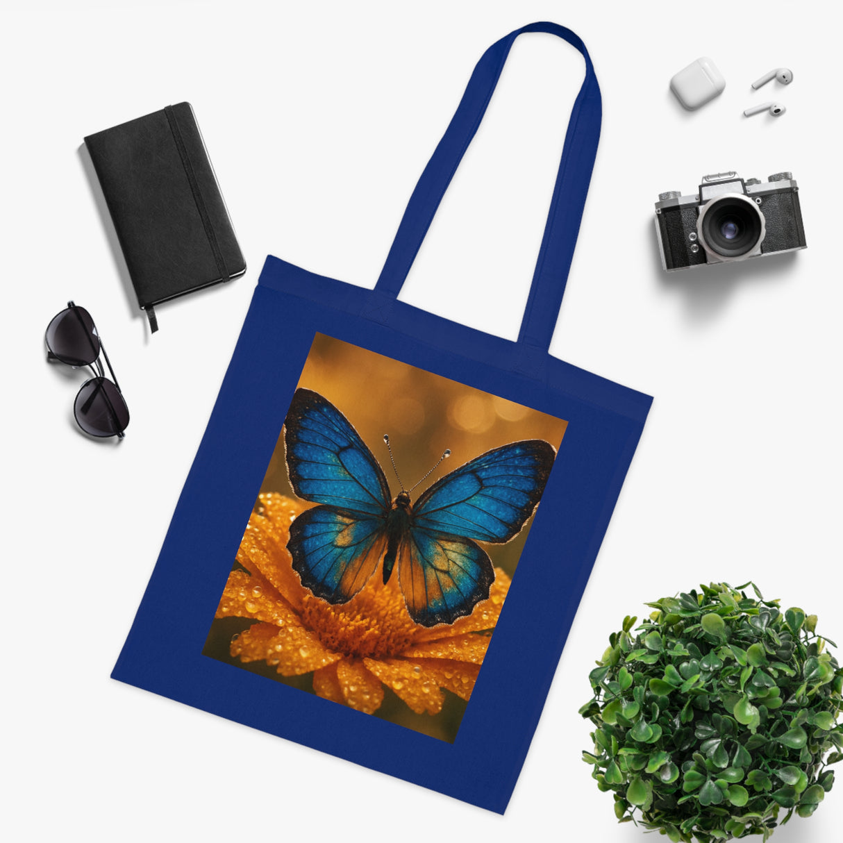 Blue Butterfly Cotton Tote — Nature Floral Reusable Shopper Bag displayed with a bunch of flowers, blending nature and utility.