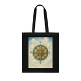 Vintage Compass Cotton Tote Bag displayed on a picnic blanket highlighting its stylish design.