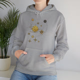 Cozy and stylish, the Celestial Compass Hoodie adorned with celestial motifs seen on a model in a relaxed pose.