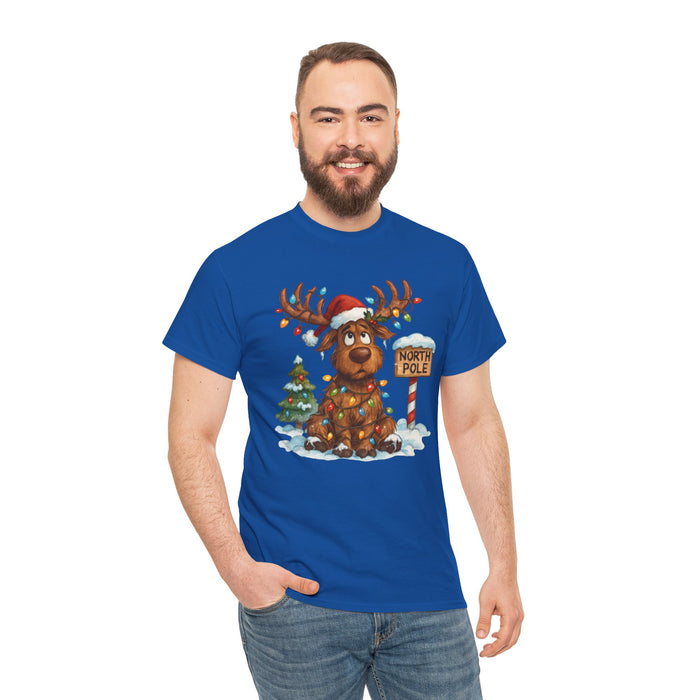 Cozy Christmas Reindeer Tee with a whimsical illustration of a reindeer in a Santa hat tangled in lights next to a holiday tree.