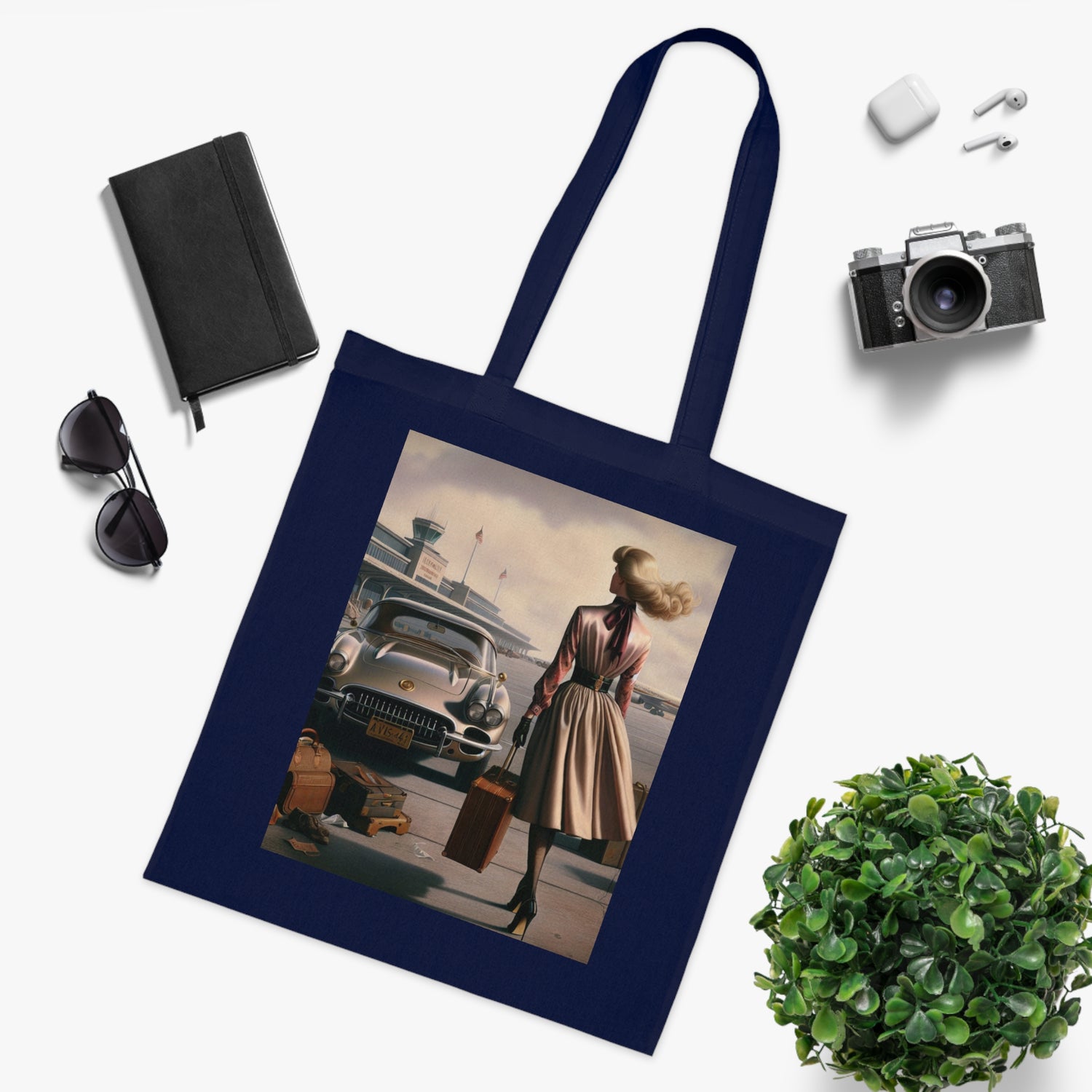 The Vintage Travel Cotton Tote Bag showcased at an outdoor event.