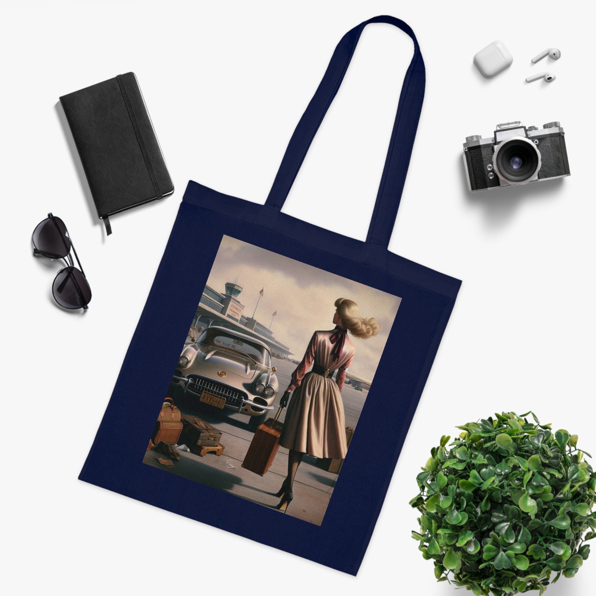 The Vintage Travel Cotton Tote Bag showcased at an outdoor event.