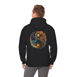 Person relaxing in the Yin Yang Moon & Sun Hoodie, demonstrating its comfort.