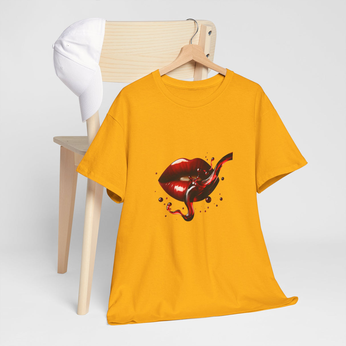 Detailed view of the glossy effect in the Lip Bite Graphic Tee's red lips design.