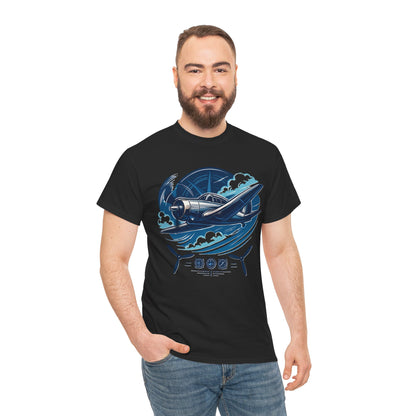 Model in Vintage Propeller Plane T-Shirt standing against a blue sky, adding flair to the aviation-inspired shirt.