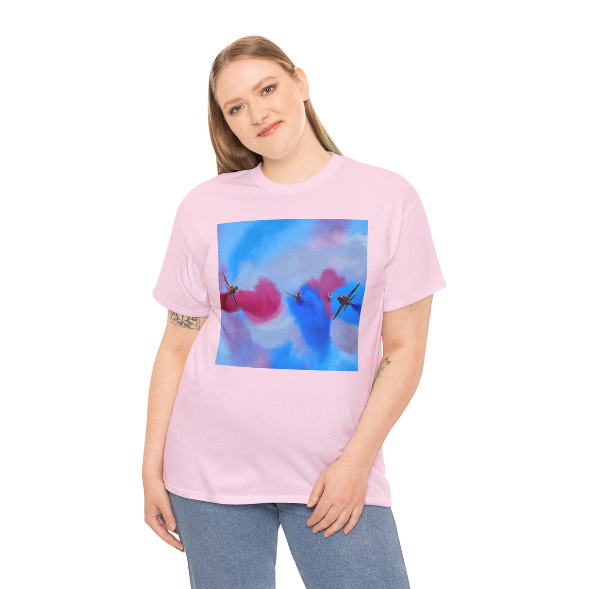 Flat lay of the Aerial Smoke Display Tee — Blue & Pink Airshow Pilots T-Shirt on a wooden surface, showing detailed print and cotton texture.