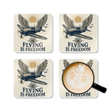 Lifestyle image of the Flying Is Freedom Cork Coaster Set in a cozy home office environment, adding a retro aviation touch.